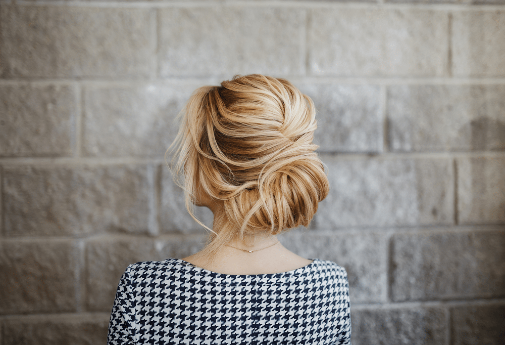 Blonde Woman hairdo french twist, rear view