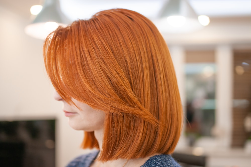 Portrait,Of,A,Woman,With,Bright,Red,Hair,And,Haircut