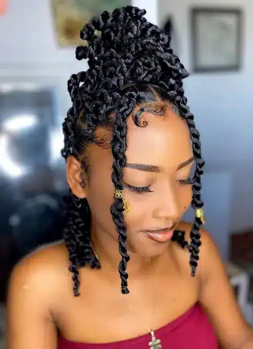 a girls with half up bun with passiontwists and framing tendrils