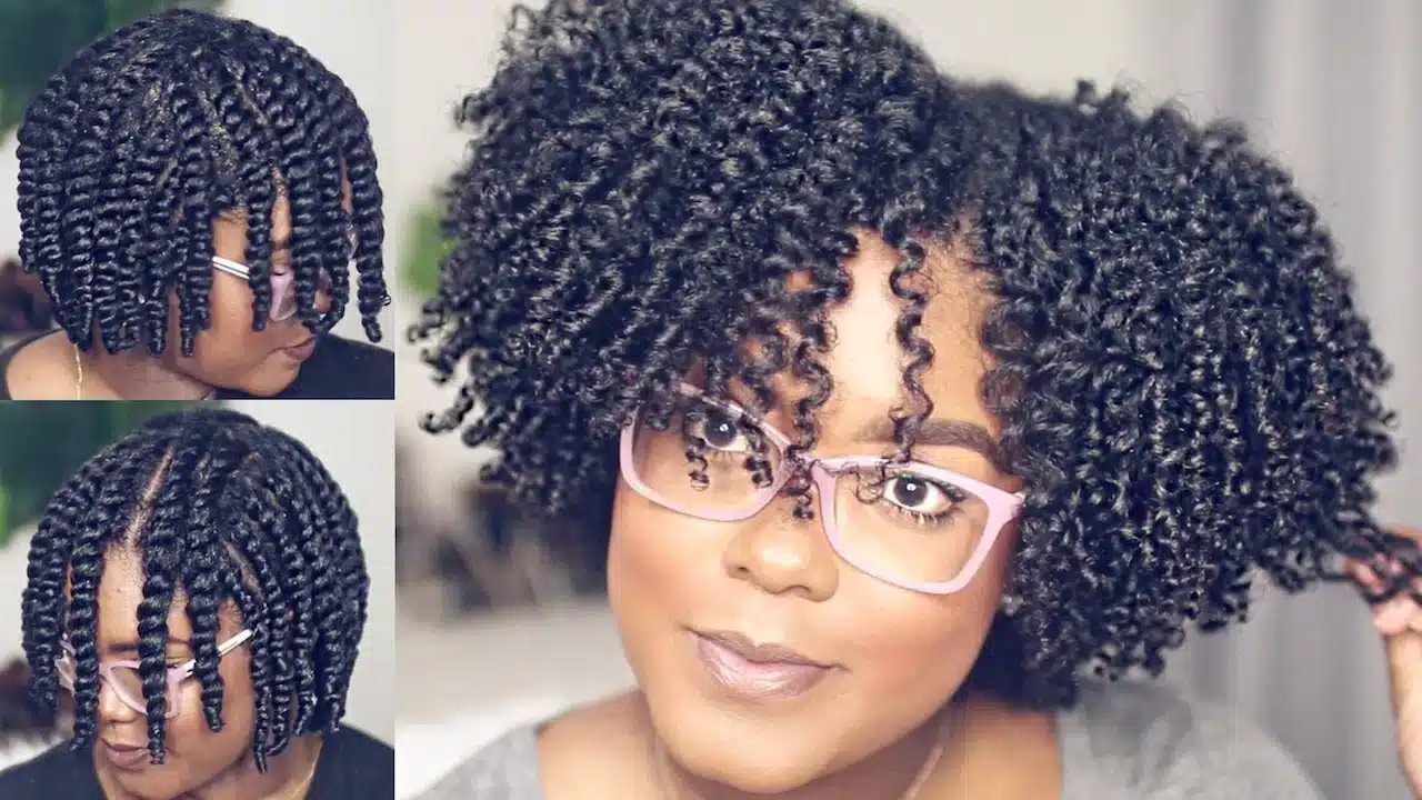 a lady wearing glasses with a Flat twist out hairstyle