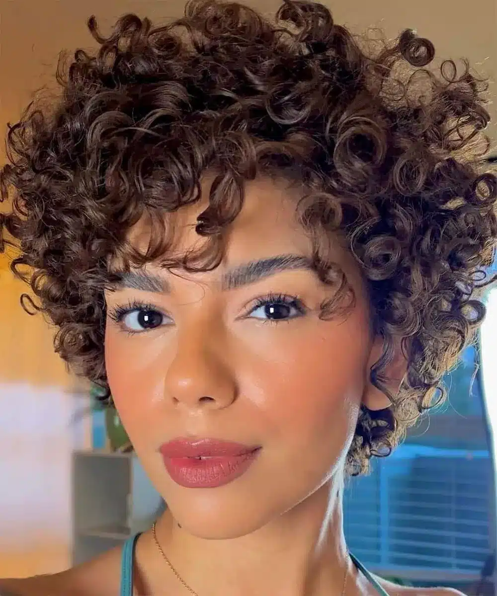 a lady with short black Curly Hairstyles