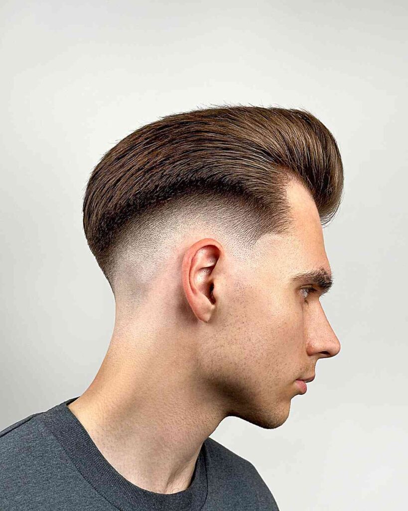 a man having high fade with pompadour haircut