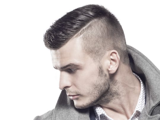 a man with side part undercur haircut