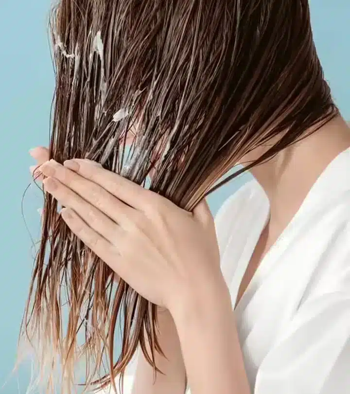 application of mousse on hair with hands