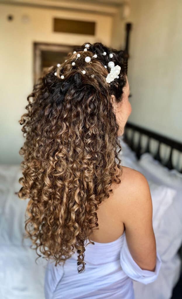 curly hair wedding style decorated with pearls