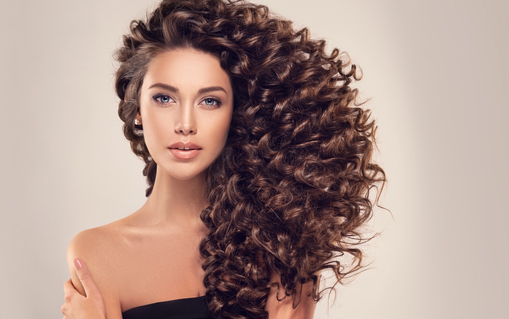 Brunette,Girl,With,Long,And,Shiny,Curly,Hair,.,Beautiful