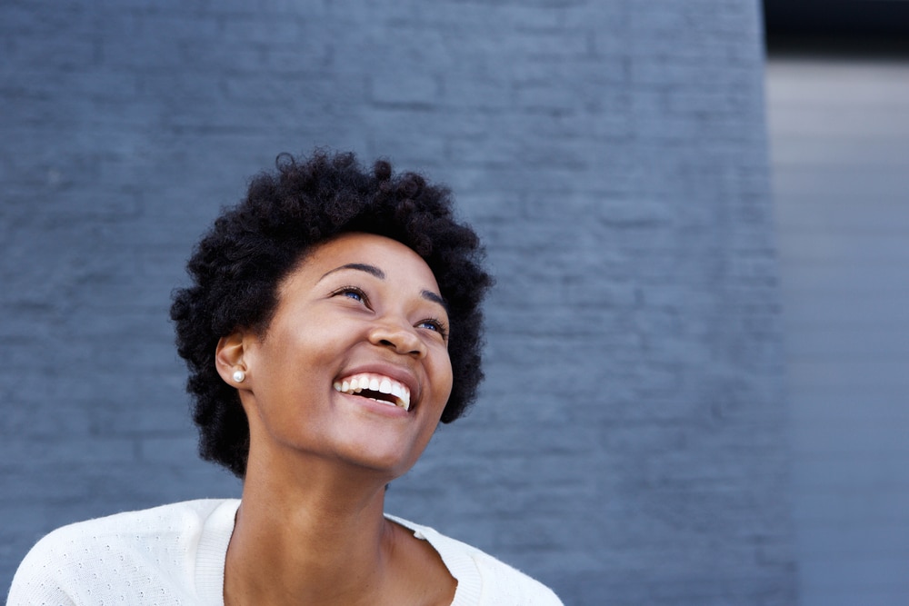 Portrait,Of,Smiling,Young,African,Woman,Looking,Away