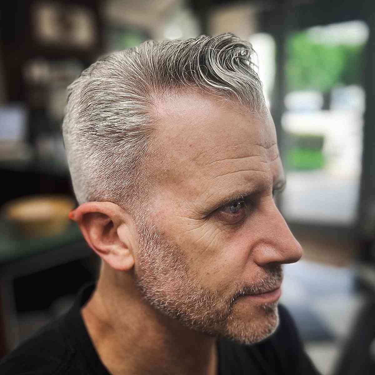 a men with greyish thin hair style